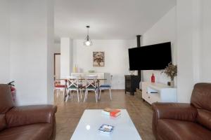 a living room with a couch and a table at Casa Nesenka 1 in Zahora