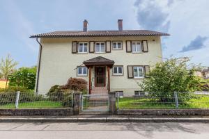 a large house with a fence in front of it at Ferienwohnung K5 in Wehr
