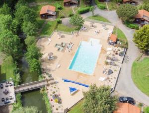 an overhead view of a pool at a resort at Mobilehome Vallon 56 in Saint-Gervais