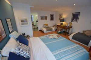 a living room with a bed and a couch at La Musicale in Rouen