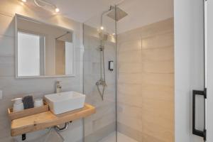 a bathroom with a sink and a mirror at Rincón De Agustín in Mácher +34 photos