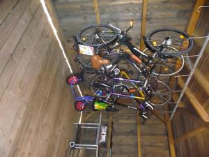 a group of bikes are hanging in a room at Maison Sulz in Montendre