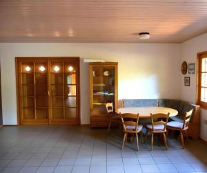 a dining room with a table and chairs at Maison Sulz in Montendre