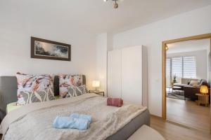 a bedroom with a large bed and a living room at Ferienwohnung San Marino 3 in Mücheln