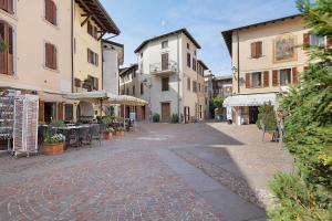 a cobblestone street in a town with buildings at Casa Donati Lucia in Tremosine Sul Garda