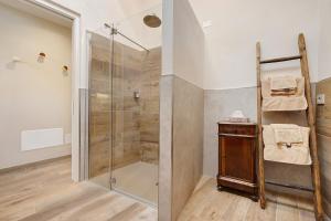 a shower with a glass door in a bathroom at Casa Donati Lucia in Tremosine Sul Garda