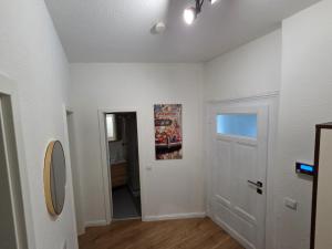 a room with white walls and a white door at Max Hinterhaus in Dresden