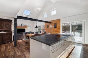 a kitchen with a counter top and a dining room at Forest Apartment - Renchen in Renchen