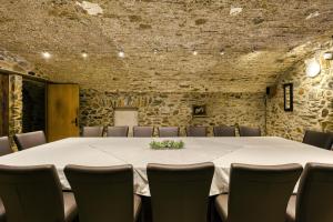 a conference room with a large table and chairs at Mas Renart in Mollet de Perelada