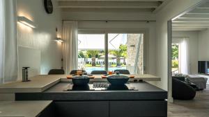 a kitchen with a table with two bowls on it at Villa Sirmione Front Lake in Sirmione