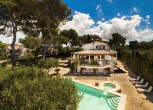 an image of a villa with a swimming pool at Charming villa by the sea in Llucmajor