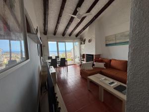 a living room with a couch and a table at Villa Mediterraneo in Tossa de Mar