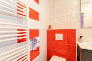 a bathroom with a toilet and a sink at Chambre - Orchis in Aroue