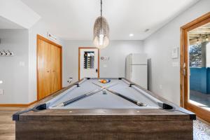 a pool table in the middle of a room at 1345 - Amarissa by the Sea in Corolla