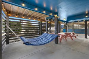 a hammock in a house with a picnic table at 1345 - Amarissa by the Sea in Corolla +95 photos