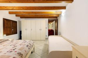 a bedroom with two beds and wooden ceilings at Le Bourg 61 - Aosta Centro in Aosta