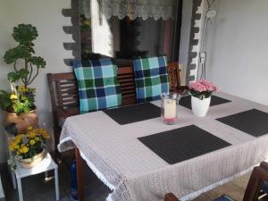 a table with a table cloth and a candle on it at Ferienhaus Werner in Neustadt