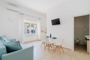 a living room with a couch and a table at Casa Anastasia in Otranto