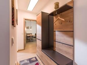 a pivot door in the hallway of a house at Fewo A6 mit Sauna und Fitnessraum in Oberaudorf