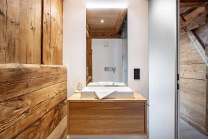 a bathroom with a sink and a mirror at Ferienhaus Kornspeicher in Hornberg +15 photos