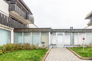 a building with a walkway in front of it at Über den Wolken in Höchenschwand