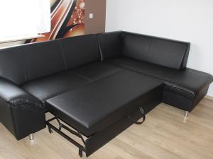 a black leather couch in a living room at Ferienwohnung Rimbach in Rimbach +22 photos