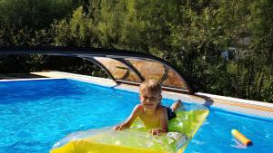 a young boy is in an inflatable at Drei Zinnen in Hiltpoltstein