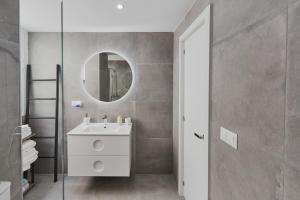 a bathroom with a white sink and a mirror at Casa Pablo City Center in Fuengirola
