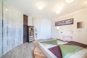 a bedroom with a bed and a large window at Apartment Belvedere in Caines +22 photos