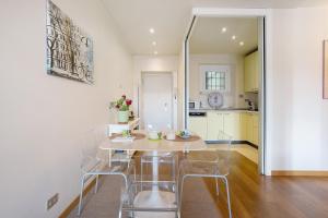 a kitchen with a table and chairs in a room at Crocetta10 in Milan