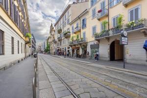 an empty street in a city with buildings at Crocetta10 in Milan