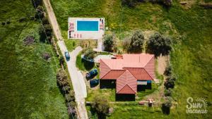 an aerial view of a house with a red roof at Malamuri 5 sun vacanze in Budoni