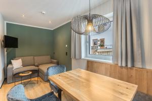 a living room with a couch and a table at Luisalle Top 3 in Auffach