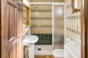 a bathroom with a sink and a toilet and a shower at La Barraca de Farena in Palafrugell +28 photos