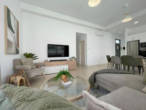 a living room with a couch and a table at Villa Lychee in Playa Blanca
