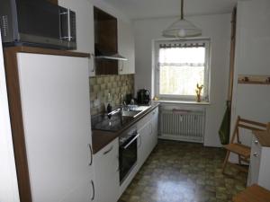a kitchen with a sink and a stove top oven at Ferienwohnung Tante Martha in Monschau