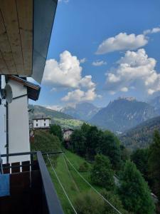 a view of mountains from a balcony of a house at Affittacamere da Annarè in Comèlico Superiore +42 photos