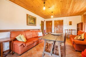 a living room with a couch and a table at Sant Grau I in Navés