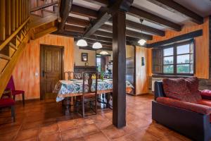a kitchen and dining room with a table and chairs at Pedregal in Gijón