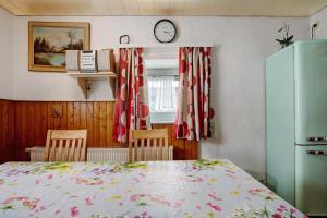 a bedroom with a bed and a clock on the wall at Haus Steinheim in Dillingen an der Donau