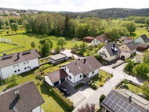an aerial view of a house with solar panels at Auenwald in Roding