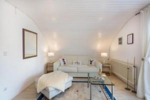 a living room with a couch and a table at Ferienwohnung Haus Oehlberg in Todtmoos