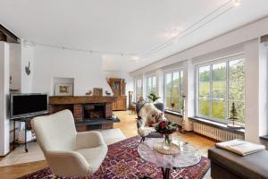 a living room with a couch and a table at Auf Der Stadtmauer in Schmallenberg