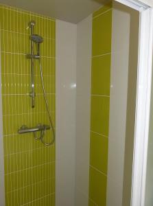 a shower with green and white tiles in a bathroom at Hâvre de Paix Perros in Perros-Guirec +14 photos