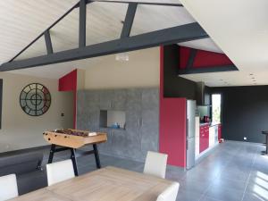 a dining room with a table and a chessboard at Hâvre de Paix Perros in Perros-Guirec