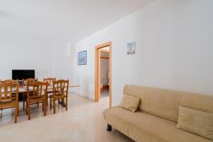 a living room with a couch and a table at Casa vacanze Elettra in centro in Otranto
