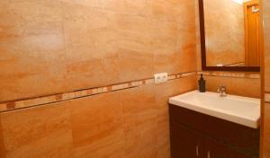 a bathroom with a sink and a mirror at Can Olivaret in Campos +21 photos