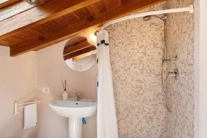 a bathroom with a shower and a sink at Casabianca - The best for bikers in Finale Ligure