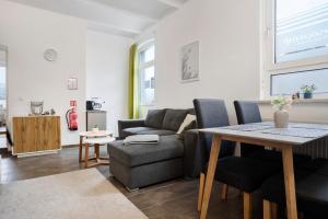 a living room with a couch and a table at Peenecamp Neukalen, Campingplatz in Neukalen