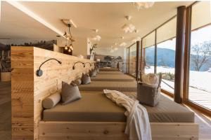 a row of benches in a room with windows at Leierhof Wicky in Rodengo +36 photos
